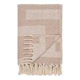 Plaid Adana en coton polyester taupe/beige sur canapé