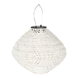 Lanterne LED Harwood blanche avec panneau solaire sur fond de jardin