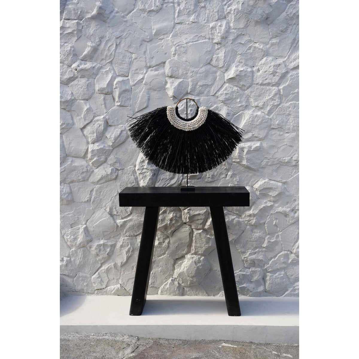 Détail des coquilles sur le présentoir Alang Cowrie