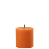 Détail de la bougie J-Line orange avec texture de cire en gros plan