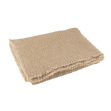 Détail du plaid J-Line en coton/polyester beige, texture douce