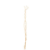 Branche de décoration J-Line en fleurs séchées, mise en scène dans un salon élégant.