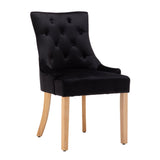 Chaise en velours noir avec coutures de boutons, vue de face