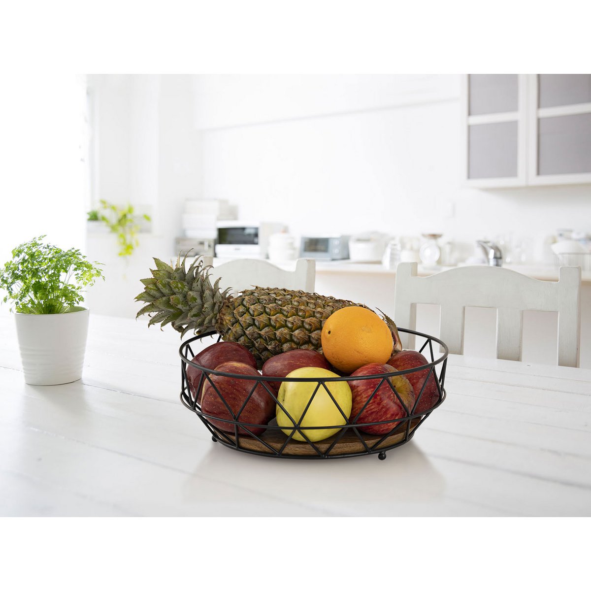 Bol à fruits en métal noir avec plancher en bois de mangue