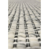 Détail du tissage artisanal du tapis Koda Caviar