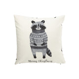 Coussin Raccoon J-Line sur un canapé, ambiance élégante