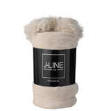 Zoom sur les pompons du plaid J-Line beige clair