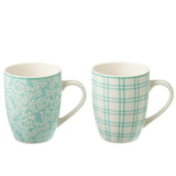Détails des tasses en céramique bleu J-Line sur table