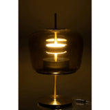 Lampe de table J-Line allumée dans un salon moderne