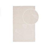 Tapis tufté main ivoire en laine dans un salon scandinave