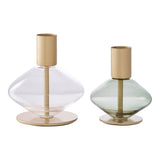 Détail du bougeoir avec base en verre vert et métal doré