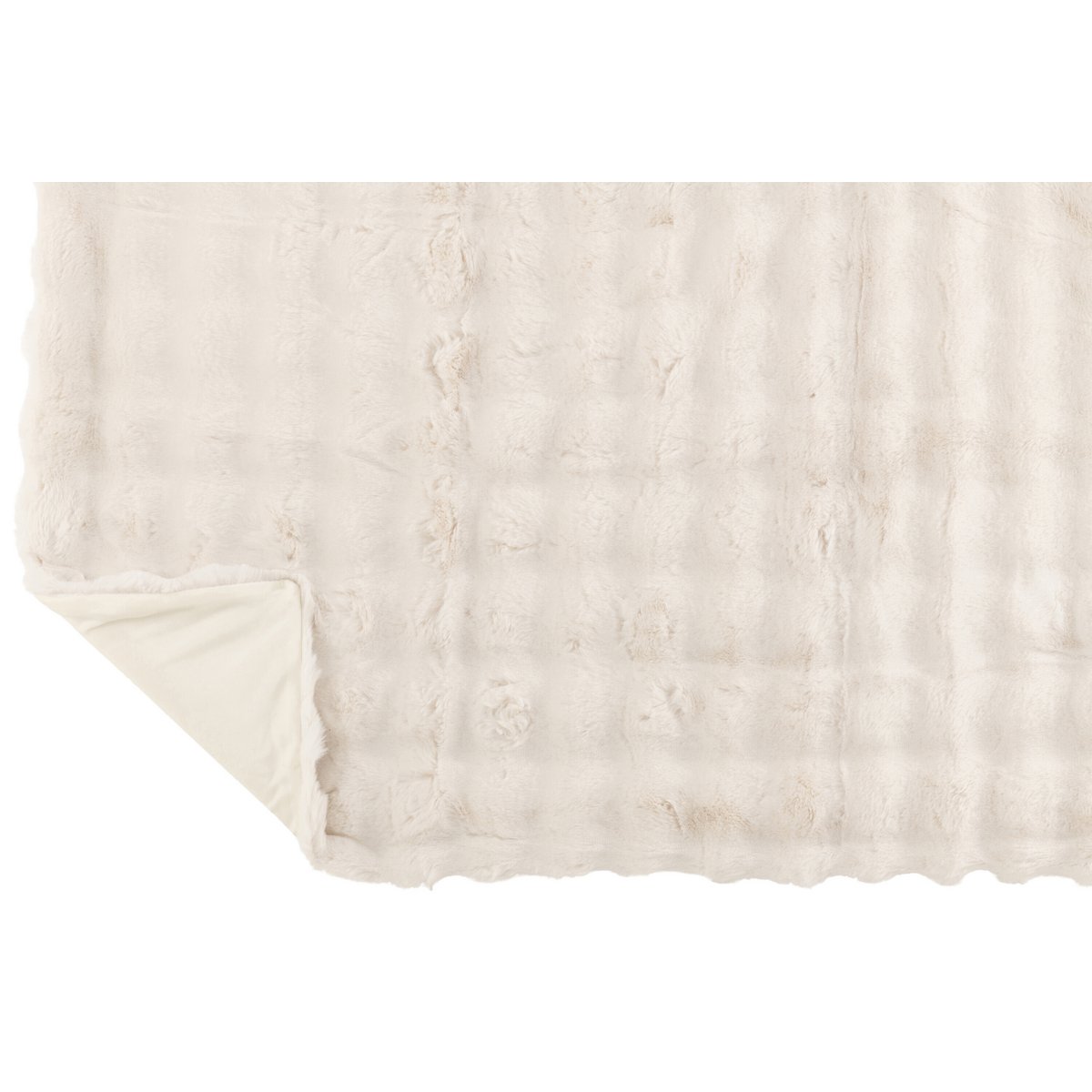 Plaid J-Line Wave drapé sur un canapé moderne