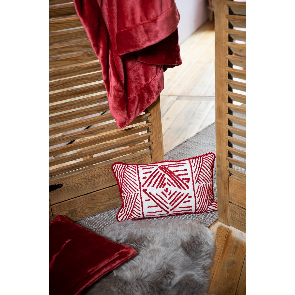 Détail du plaid Tender Rubis, texture douce et veloutée