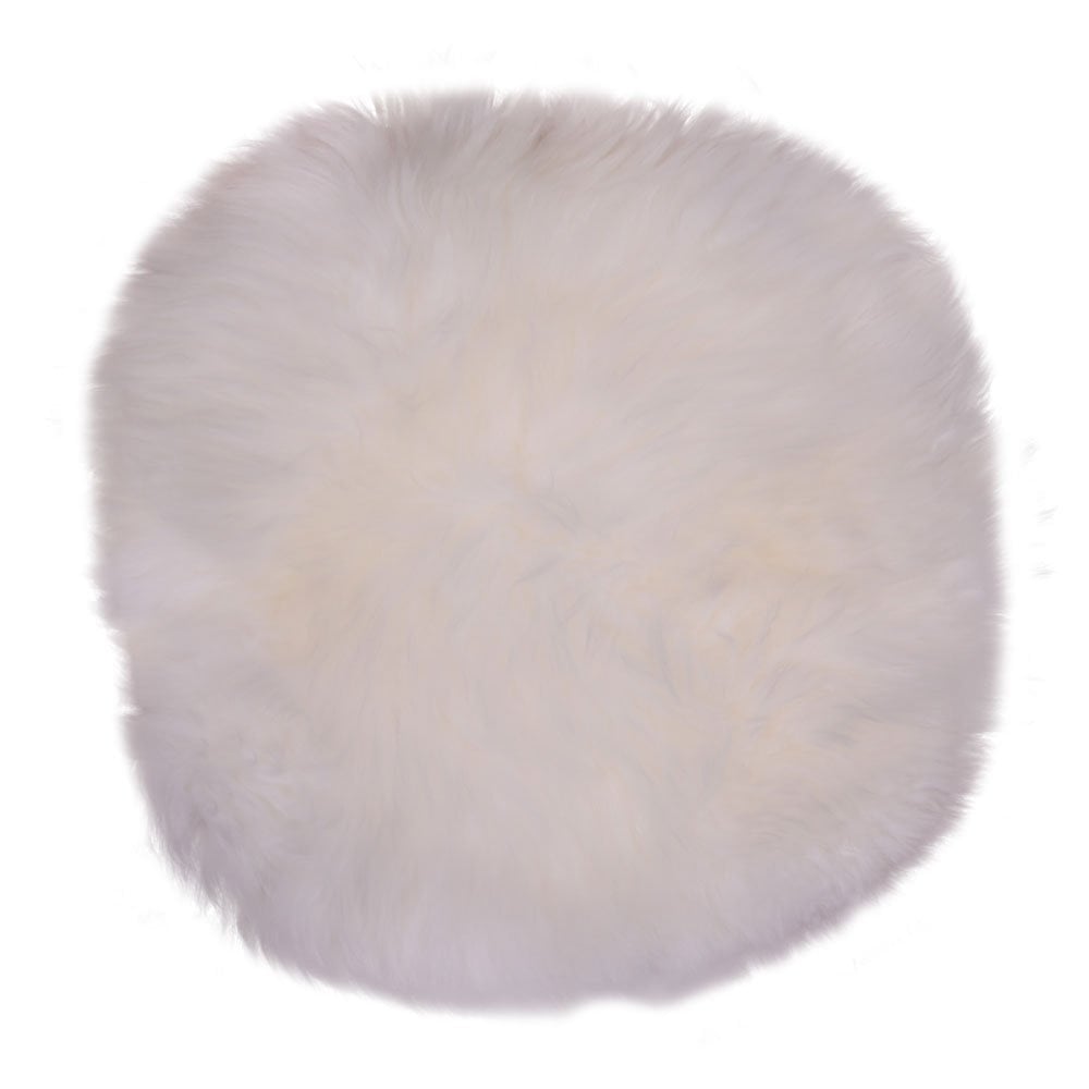Coussin rond en peau d'agneau, ambiance scandinave cosy