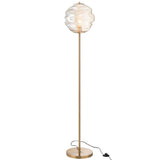 Lampadaire J-Line Bijenkorf éclairant une pièce avec élégance