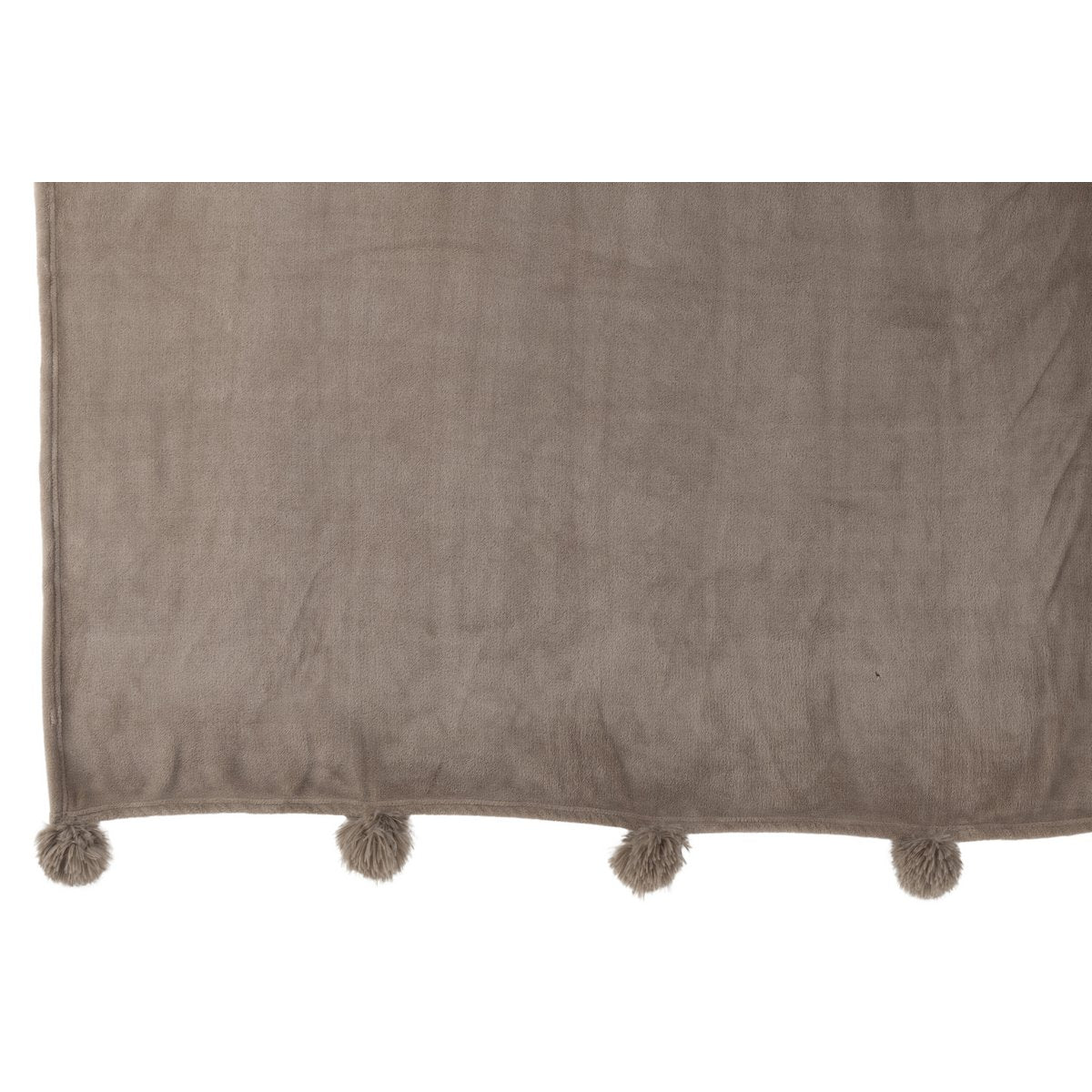 Ambiance chaleureuse avec le plaid Pompon J-Line dans un salon