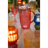 Carafe J-Line rouge sur une table élégante