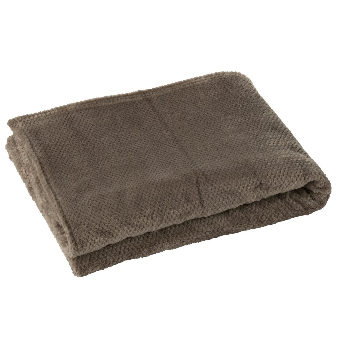 Couverture J-Line Snuggle drapée sur un canapé moderne