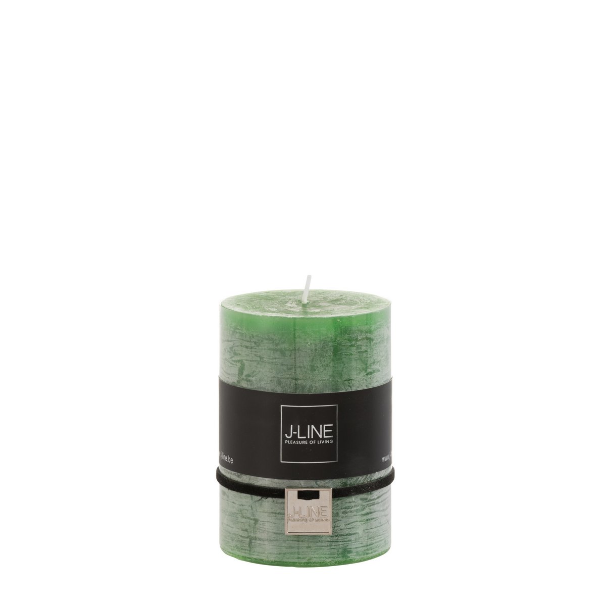 Bougie J-Line vert clair sur table, créant une ambiance chaleureuse