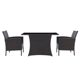 Salon de jardin en rotin avec table en verre et coussins marron