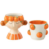 Pot de fleurs J-Line en céramique orange avec un design moderne
