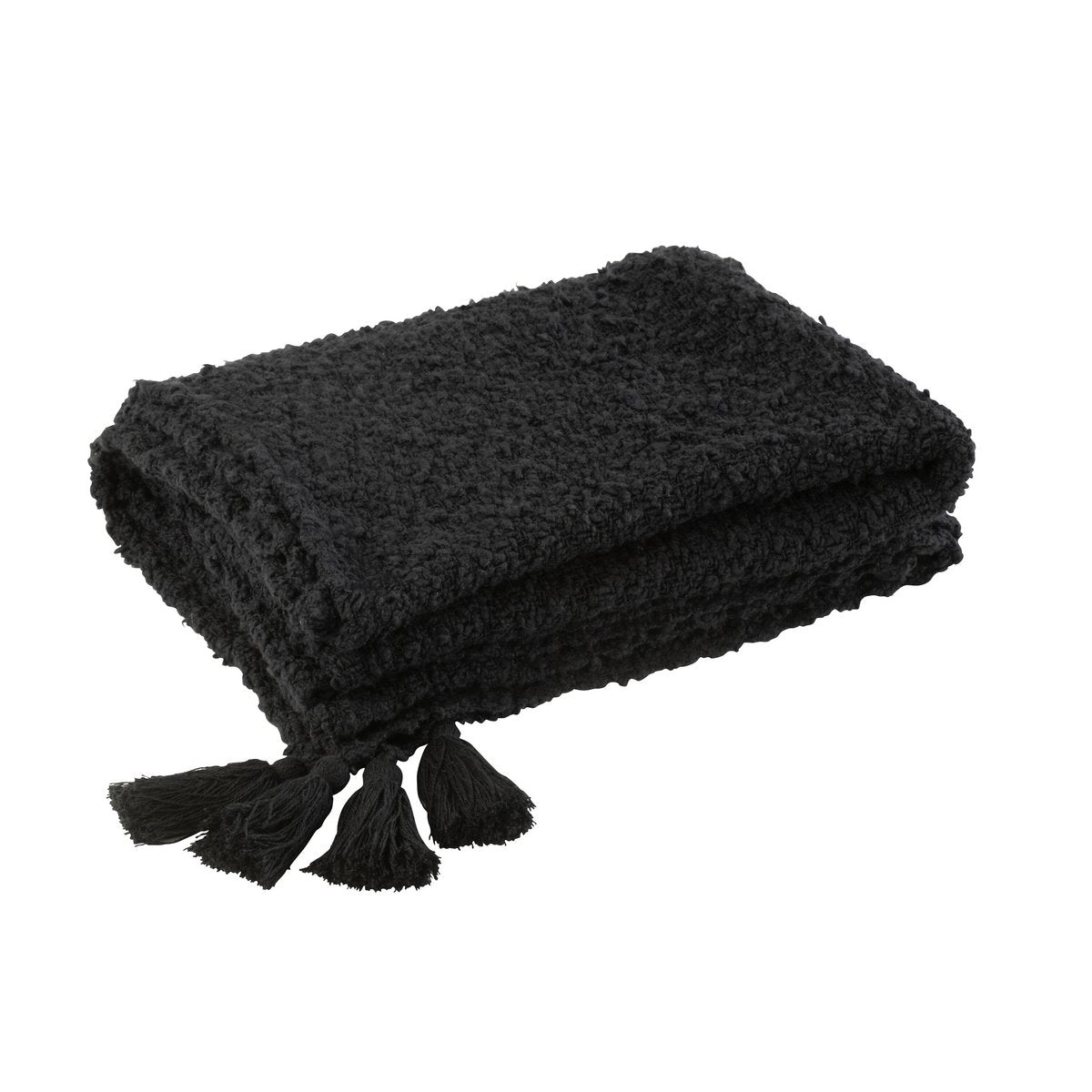 Plaid J-Line en coton noir, posé sur un canapé, style scandinave