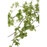 Plante artificielle J-Line avec feuilles fines vertes et noires, vue d'ensemble.