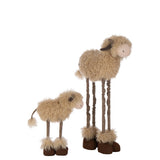 Figurine J-Line Vache Télescopique sur un meuble décoratif