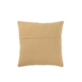 Coussin J-Line en coton beige posé sur un canapé