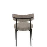 Chaise Bouclé J-Line dans un salon moderne, ambiance élégante.