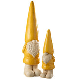 Gnome extérieur J-Line dans un jardin fleuri, ambiance chaleureuse