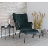 Détail du coussin en velours vert du repose-pieds Glasgow