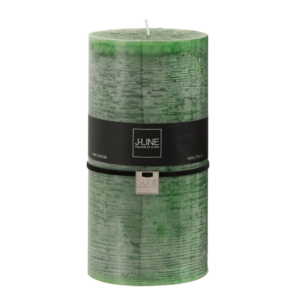 Bougie J-Line en cire vert clair illuminant un espace intérieur