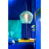 Lampe J-Line en verre vert sur une table moderne