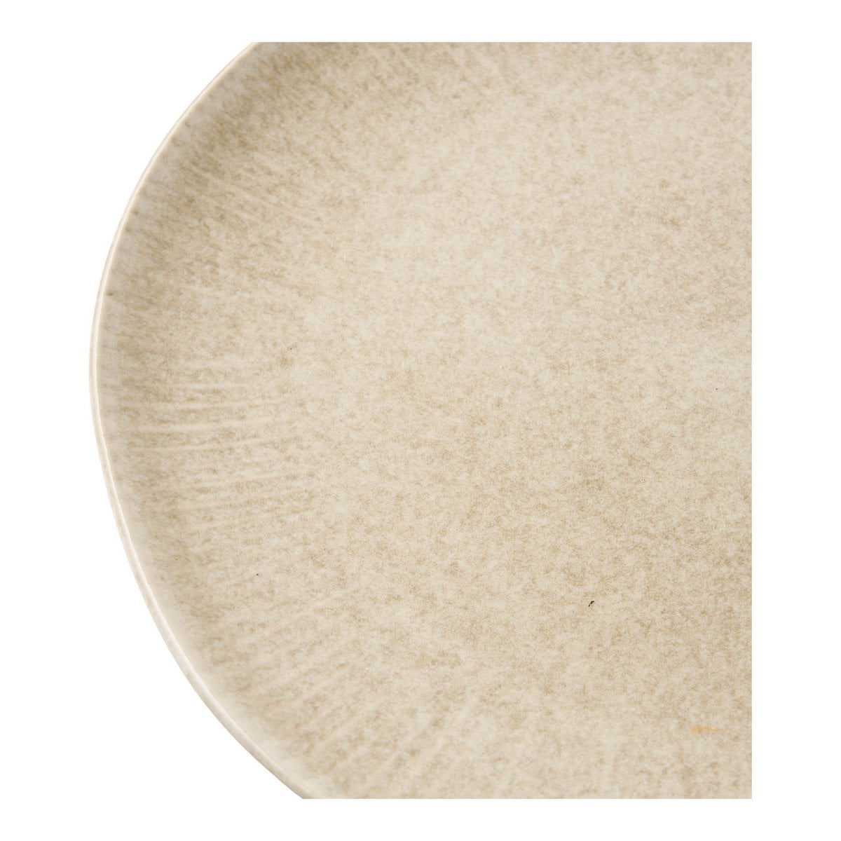 Assiette Viola en céramique beige, mise en scène sur une table