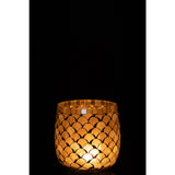 Bougeoir J-Line sur une table, créant une ambiance lumineuse