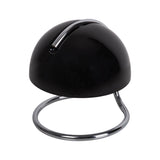 Vue latérale de la lampe Burano noir sur une table de chevet.