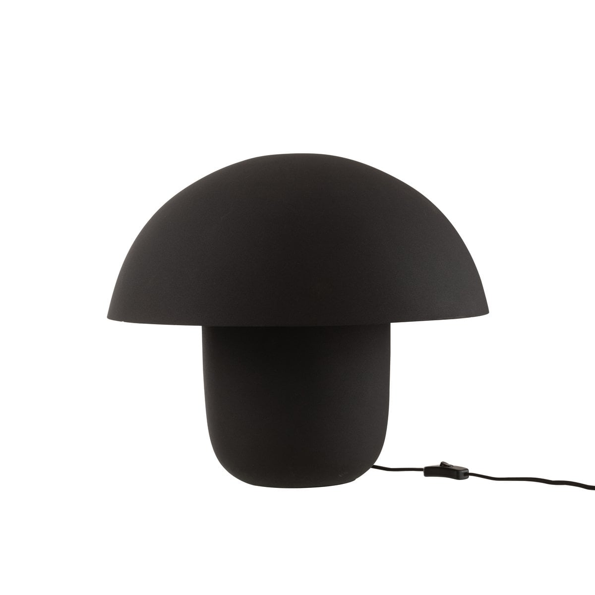 Lampe de table J-Line sur une table décorée