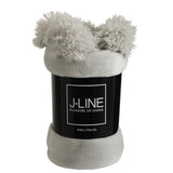 Ambiance cosy avec le plaid J-Line gris clair dans un salon