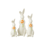 Détail des figurines Lapins Fleurs en porcelaine, montrant les motifs floraux et les couleurs éclatantes