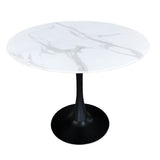 Table ronde en verre marbré avec base en métal noir, vue d'ensemble