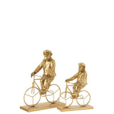 Détail de la figurine Monkey Bicycle en or, mettant en valeur le design moderne