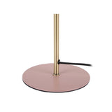 Lampe Bonnet sur une table d'appoint, créant une ambiance chaleureuse.