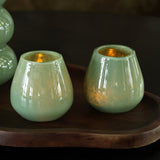 Lot de 2 photophores en verre vert