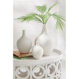 Branche artificielle J-Line en plastique vert avec neuf feuilles