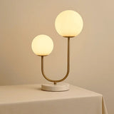 Lampe à poser en marbre blanc et métal doré