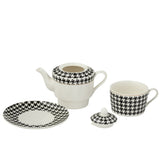 Théière J-Line Pied-Poule en porcelaine blanche et noire, vue de face.