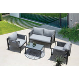 Salon de jardin avec table basse en verre et coussins