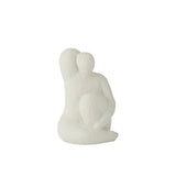 Profil de la sculpture Vénus en ciment blanc, mettant en avant ses lignes épurées.