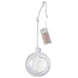 Boule de Noël LED J-Line en verre blanc, éclairée, sur table